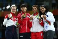 RIO DE JANEIRO, BRAZIL - AUGUST 17:  Sakshi Malik of India celebrates after defeating Aisuluu Tynybekova of Kyrgyzstan during the Women's Freestyle 58 kg Bronze match on Day 12 of the Rio 2016 Olympic Games at Caioca Arena 2 on August 17, 2016 in Rio de Janeiro, Brazil.  (Photo by Lars Baron/Getty Images)